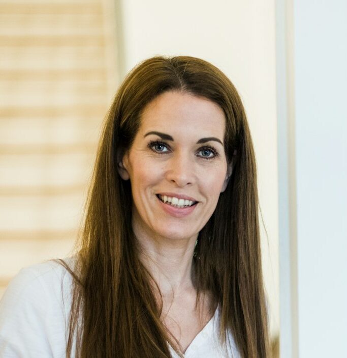 Portrait of smiling woman at home